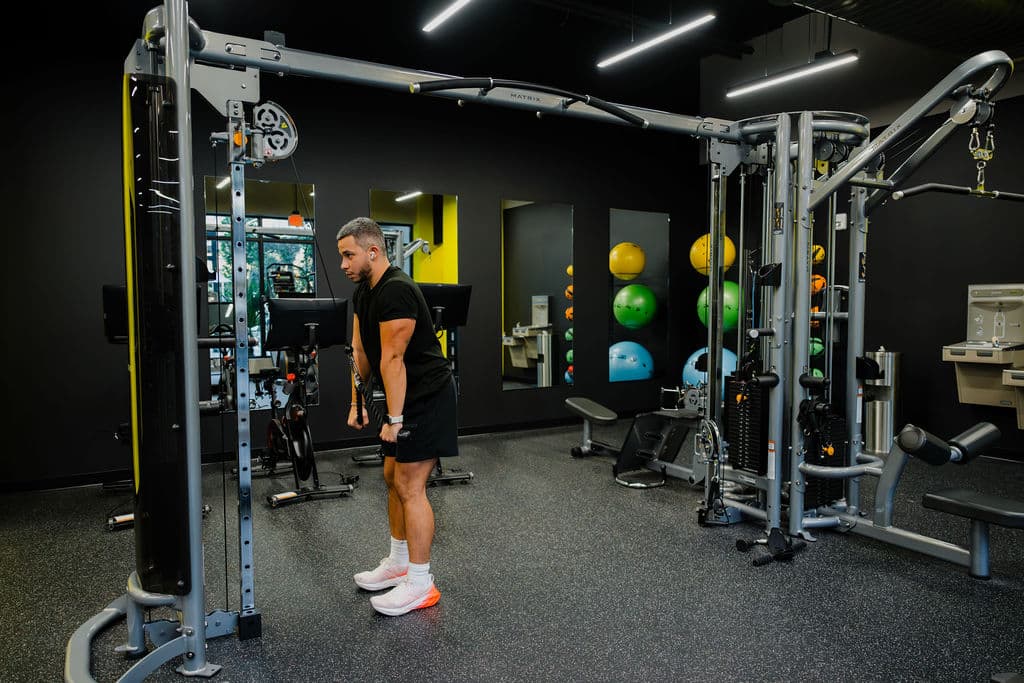 Full fitness center with cable machines at Metro Parc