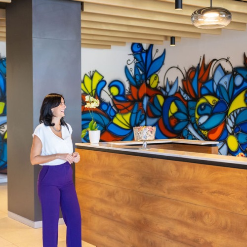 women talking in a lobby